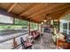 Covered patio with a fireplace, comfortable seating, and serene outdoor views at 2310 Gill Jordan Rd, Chester, SC 29706