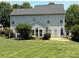 A spacious, well-manicured backyard with lush green grass and a black metal fence at 2567 Holly Oak Ln, Gastonia, NC 28056