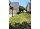 A spacious, well-manicured backyard with lush green grass and a black metal fence at 2567 Holly Oak Ln, Gastonia, NC 28056