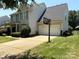 Charming two-story home with a well-manicured front yard and a two car garage at 2567 Holly Oak Ln, Gastonia, NC 28056