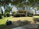 Charming two-story home with a well-manicured front yard and a two car garage at 2567 Holly Oak Ln, Gastonia, NC 28056