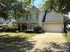 Charming two-story home with a well-manicured front yard and a two car garage at 2567 Holly Oak Ln, Gastonia, NC 28056