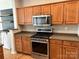 Well-equipped kitchen with stainless steel appliances and ample cabinet space at 2567 Holly Oak Ln, Gastonia, NC 28056