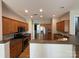 Open kitchen layout featuring stainless steel appliances and a convenient breakfast bar at 2567 Holly Oak Ln, Gastonia, NC 28056