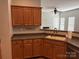 Kitchen showcasing wooden cabinets, countertops, and a sink with fixtures at 2567 Holly Oak Ln, Gastonia, NC 28056
