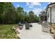 Backyard patio featuring outdoor seating, outdoor kitchen area, and wooded views at 2577 Bonnybrook Cir, Rock Hill, SC 29732