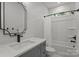 Bathroom with framed mirror, dark hardware, shower and tub with white shower curtain at 2577 Bonnybrook Cir, Rock Hill, SC 29732