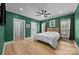 Well-lit bedroom with hardwood floors, a ceiling fan, and ample natural light at 2577 Bonnybrook Cir, Rock Hill, SC 29732