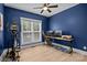 Bedroom featuring an exercise machine, blue walls, wood floors, and ceiling fan at 2577 Bonnybrook Cir, Rock Hill, SC 29732