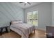 Bedroom with accent wall, wood flooring, neutral color palette, and natural light at 2577 Bonnybrook Cir, Rock Hill, SC 29732