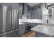 Modern kitchen with gray cabinets, stainless steel appliances, and white countertops at 2577 Bonnybrook Cir, Rock Hill, SC 29732