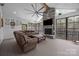Bright and spacious living room with a stone fireplace and large windows at 2577 Bonnybrook Cir, Rock Hill, SC 29732