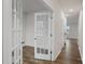 Bright hallway with wood floors and glass-paneled doors at 2617 Goose Fair Rd # 59, Maiden, NC 28650