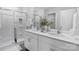 Bright bathroom featuring double sinks, a glass-enclosed shower, and modern fixtures at 2617 Goose Fair Rd, Maiden, NC 28650
