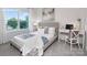 Bright bedroom with a large window, study desk, and neutral decor at 2617 Goose Fair Rd, Maiden, NC 28650
