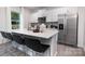 Bright kitchen with stainless steel appliances, a large island with seating, and sleek white cabinets at 2617 Goose Fair Rd, Maiden, NC 28650