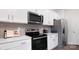 Contemporary kitchen featuring stainless steel appliances, white countertops, and ample cabinet space at 2617 Goose Fair Rd, Maiden, NC 28650