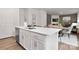 Open kitchen with a center island, stainless steel appliances, and a view into the dining area at 2617 Goose Fair Rd, Maiden, NC 28650