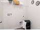Functional laundry room with storage shelf, laundry hamper and clean, white walls at 2617 Goose Fair Rd, Maiden, NC 28650