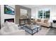 Stylish living room with a modern fireplace, comfortable seating, and a bright window at 2617 Goose Fair Rd, Maiden, NC 28650
