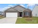 Charming single-story home with a brick facade, attached garage, and well-maintained lawn at 2650 Goose Fair Rd, Maiden, NC 28650