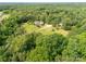 Wide aerial perspective of the property, highlighting the lush surroundings and private setting at 2818 Neill Rd, Lancaster, SC 29720