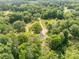 Expansive aerial view of a secluded property, showcasing lush greenery and a private pond at 2818 Neill Rd, Lancaster, SC 29720