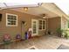 Covered back porch with string lights, ceiling fan, and outdoor furniture at 2818 Neill Rd, Lancaster, SC 29720