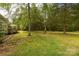 Large backyard with trees, partially wooded view, and room to roam at 2818 Neill Rd, Lancaster, SC 29720