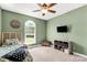Bright bedroom featuring a ceiling fan, entertainment center, and comfortable bed at 2818 Neill Rd, Lancaster, SC 29720