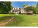 Beautiful home with a welcoming front porch, complemented by a well-maintained lawn and rock lined landscape at 2818 Neill Rd, Lancaster, SC 29720