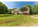 Beautiful home featuring dormer windows, a welcoming front porch, complemented by an expansive green lawn at 2818 Neill Rd, Lancaster, SC 29720