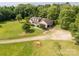 Well-maintained home with an attached garage on a large, picturesque lawn surrounded by trees at 2818 Neill Rd, Lancaster, SC 29720