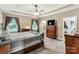 Main bedroom featuring a tray ceiling, dresser, and exterior views at 2818 Neill Rd, Lancaster, SC 29720