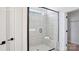 Contemporary bathroom showcasing a frameless glass shower with a built-in bench, and modern fixtures at 3128 Spring Iris Dr, Denver, NC 28037