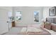 Bright bedroom with two windows, a cozy bed with decorative pillows, and a functional desk area at 3128 Spring Iris Dr, Denver, NC 28037