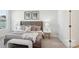 Comfortable bedroom with a stylish upholstered headboard, neutral tones, and soft textures for a relaxing atmosphere at 3128 Spring Iris Dr, Denver, NC 28037