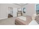 Bright bedroom featuring carpet floors, a modern console table, and neutral paint at 3128 Spring Iris Dr, Denver, NC 28037