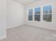 Bright bedroom with three large windows offering plentiful natural light at 3128 Spring Iris Dr, Denver, NC 28037