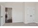 Light filled room with a closet with double doors, connecting door to another part of the house and neutral color scheme at 3128 Spring Iris Dr, Denver, NC 28037