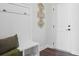 The Entryway area offers a storage bench, decorative wall art, and a coat rack with hooks at 3128 Spring Iris Dr, Denver, NC 28037