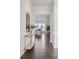 Bright entryway featuring hardwood floors and modern decor, leading to an open living space at 3128 Spring Iris Dr, Denver, NC 28037