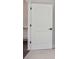 White interior door with a black handle and carpeted floors at 3128 Spring Iris Dr, Denver, NC 28037