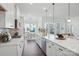 Modern kitchen featuring stainless steel appliances, a spacious island, and an open layout at 3128 Spring Iris Dr, Denver, NC 28037
