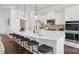 Stylish kitchen with a large island, modern pendant lighting, and stainless steel appliances at 3128 Spring Iris Dr, Denver, NC 28037