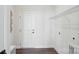 Neat laundry room offers a wire shelf for storage, washer and dryer hookups, and wood flooring at 3128 Spring Iris Dr, Denver, NC 28037