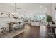 Spacious open-concept living area flowing seamlessly into the kitchen and dining space with abundant natural light at 3128 Spring Iris Dr, Denver, NC 28037