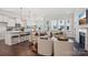 Bright open living space featuring a modern kitchen, comfortable seating, and large windows for natural light at 3128 Spring Iris Dr, Denver, NC 28037