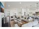 Open concept living space connects living room, dining area, and kitchen in a bright, airy design at 3128 Spring Iris Dr, Denver, NC 28037