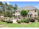 Expansive backyard featuring a well-maintained lawn, mature trees, brick home, and inviting outdoor spaces at 3204 Mcpherson St, Waxhaw, NC 28173